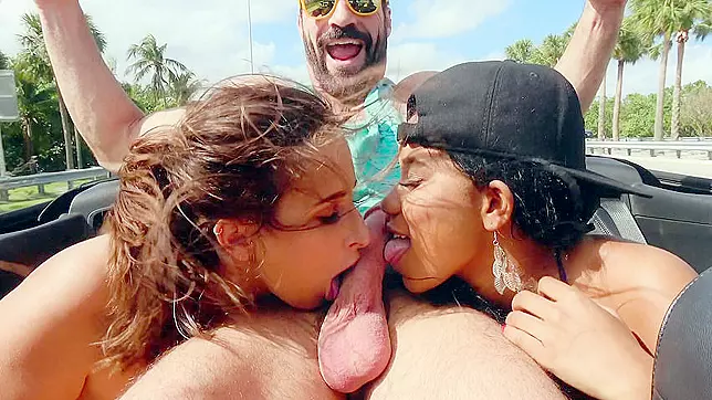 Two kinky babes ae willing to suck the dude's XXX cock in a moving car