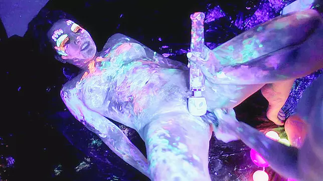 Threesome XXX activity of the fluorescent lesbians in the dark room