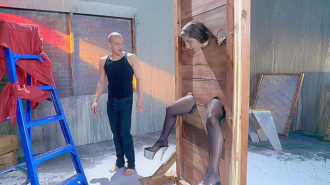 Abella Danger stuck in the pillory and got her throat fingered