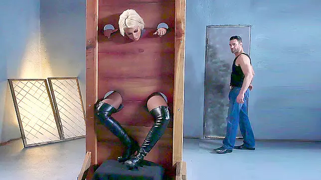 Bridgette B is put into the pillory and gets her both holes fingered