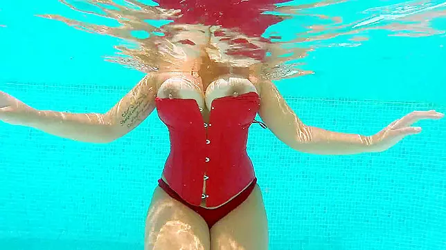 Goddess in red leather outfit shakes amazing XXX part in the pool