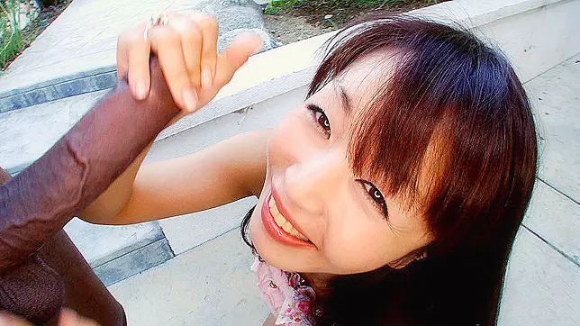 Petite Japanese minx not shy to suck huge black XXX weenie outdoors