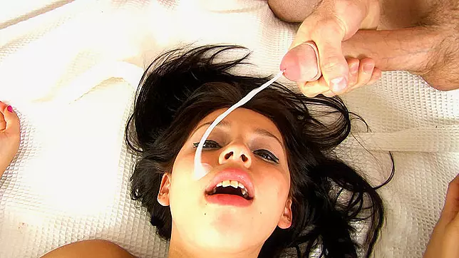 Cute Latina in XXX fishnets gets facial from two cocks in threesome